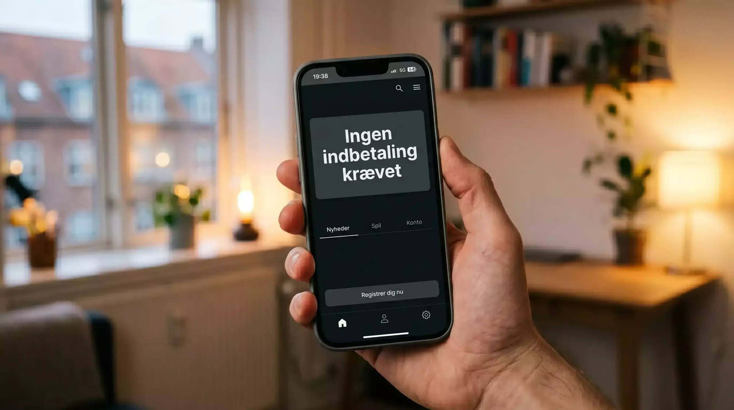 Mobiltelefon med dansk bookmaker-app og teksten
